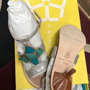 New with box Trina Turk sandals 7.5 platinum color with Turquoise.